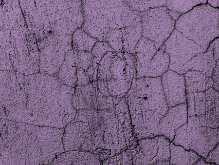 Abstract cracked purple grunge concrete wall distressed texture as backgroundの写真素材