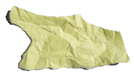 Ripped crumpled torn yellow paper piece on white background, paper tear cut out design elementの写真素材