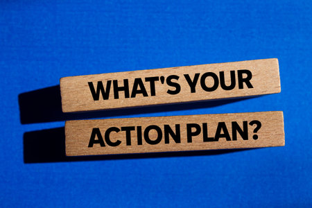 What's your action plan message written on wooden blocks on blue background. Conceptual what's your action plan symbol. Copy space.の写真素材