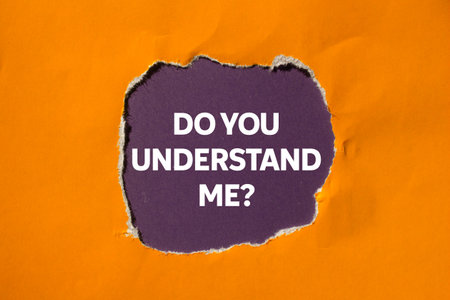 Do you understand me message written on torn orange paper on purple background. Conceptual do you understand me symbol. Copy space.の写真素材