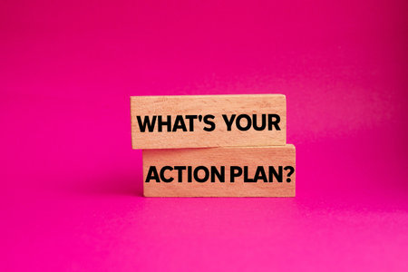 What's your action plan message written on wooden blocks on pink background. Conceptual what's your action plan symbol. Copy space.の写真素材