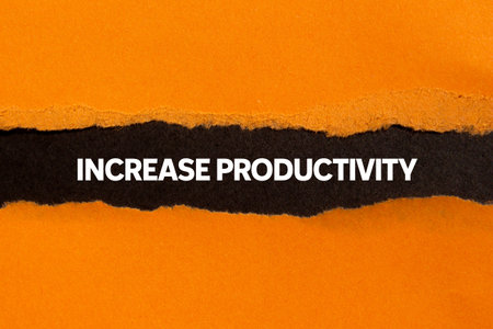 Increase productivity message written on ripped torn orange paper on black background. Conceptual increase productivity symbol. Copy space.の写真素材