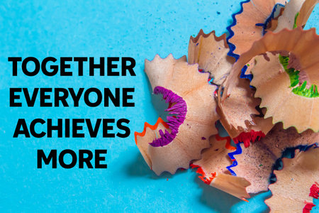 Together everyone achieves more message written on blue background. Conceptual together everyone achieves more symbol. Copy space.の写真素材