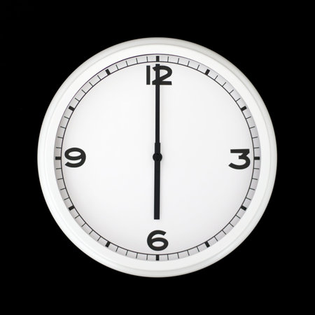 White round analog wall clock isolated on black background, its six oclock.