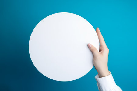 circle empty white mockup in hand on blue background generative ai.の素材