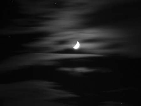 A black and white moon with starsの写真素材