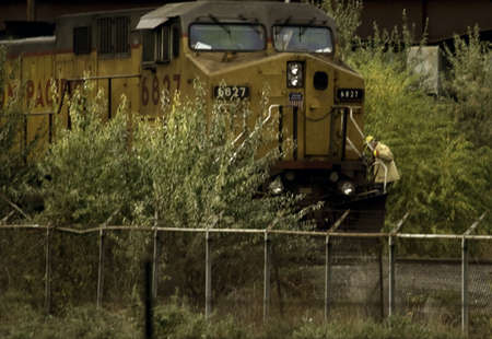 Man Working on a train engine