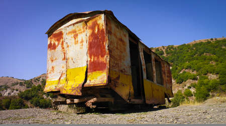 Old rusty abandoned wagon.  An abandoned rusty train wagon left outside in the nature.の写真素材