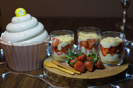 Magnolia dessert in cups. Decorated with light and cake cup.の写真素材