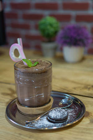 Fresh Filabingo drink. Cocktail made from cacao. Served on metal plate and with cookie.の写真素材