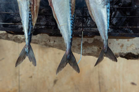 Tails of grilled fishes. Close-up from above.の写真素材