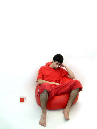 men sitting in an armchairの写真素材