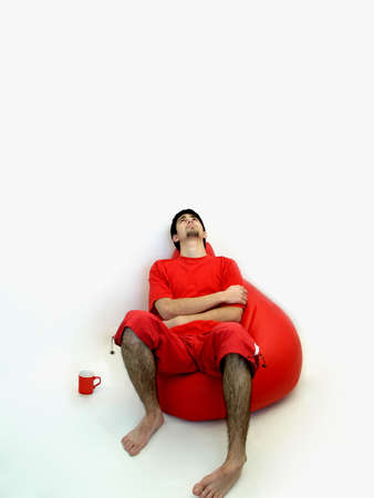 men sitting in an armchairの写真素材