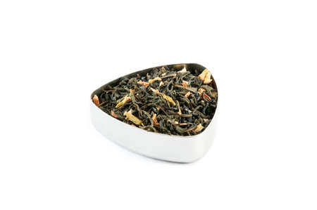 Vietnam jasmine, a vietnamese green tea with jasmine petals, in a metal containerの写真素材