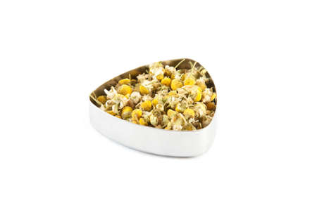 Chamomile tea in a metal containerの写真素材