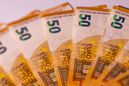 Euro banknotes close-up on a white background. Shallow depth of fieldの写真素材