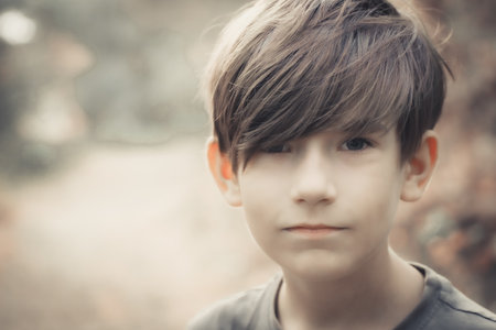 Portrait of a boy in the forest. Selective focus.の写真素材