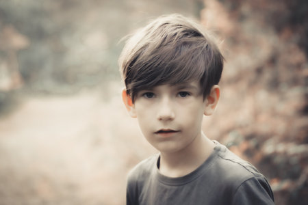 Portrait of a boy in the park. Selective focus.の写真素材