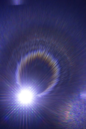 abstract background with rays and bokeh defocused lights.の写真素材