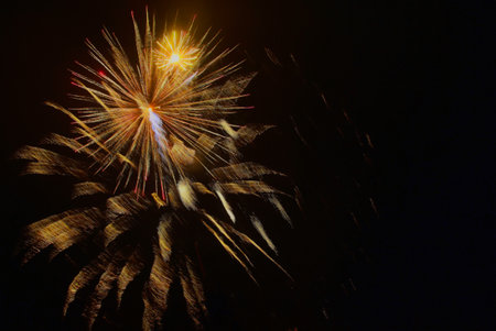 Colorful fireworks on the black sky background, closeup of photo