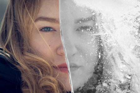 beautiful girl in the winter in the snow, closeup portrait