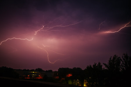 Lightning in the night sky. Thunderstorm, lightning strike.