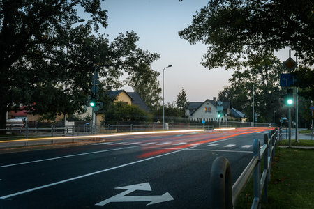Long exposure of car light trails on a city street at dusk.の写真素材