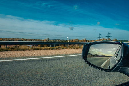 View from the car on the road with the windscreen mirror.の写真素材