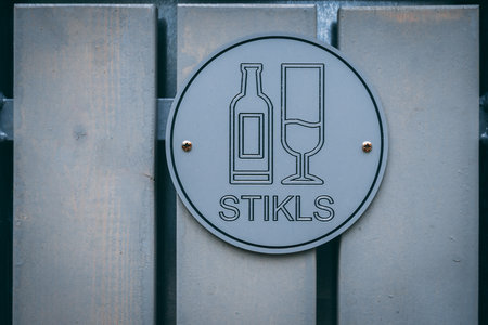 Wine list sign on a metal surface. Selective focus.