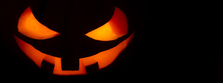 Halloween pumpkin in smoke. Halloween pumpkin smile and scary eyes for party. Close up view of a...