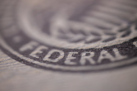 A closeup shot of a stamp on a wooden surface with a blurred backgroundの写真素材