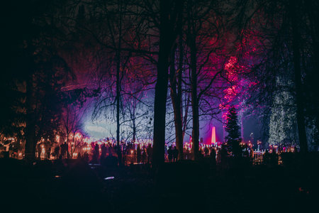 Crowd of people at the cemetery during the night in the cityの写真素材