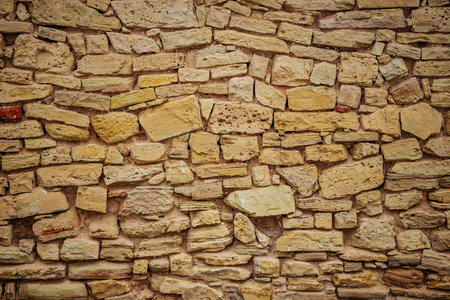 Background of stone wall texture. Closeup of stone wall texture.の写真素材