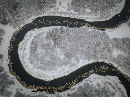 Aerial view of a frozen river in winter. Toned. River Gaujaの写真素材