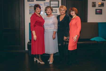 Elderly women in red dresses at the reception of the psychologistの写真素材