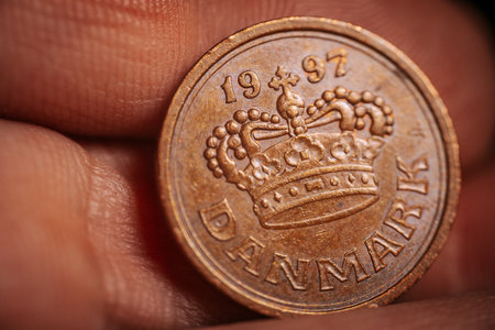 Euro coin with a crown in the palm of your hand close-upの写真素材