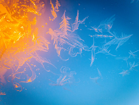 Frosty natural pattern on window glass. Abstract winter background.の写真素材