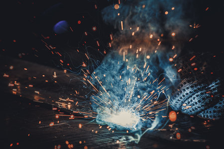 Welding sparks from electric arc welding machine. Industrial background.の写真素材