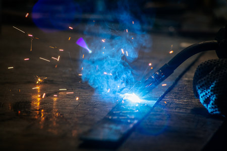 Welding of metal structures with sparks, close-up.の写真素材