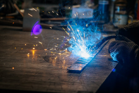 welder, craftsman, erecting technical steel Industrial steel welder in factory