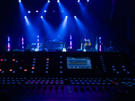 Dj mixer on stage in nightclub with stage lights and equipment.の写真素材