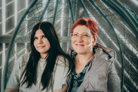 Portrait of a middle-aged woman and her teenage daughter.の写真素材