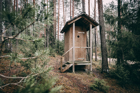 Toilet in the forest. Outdoor toilet wooden structureの写真素材