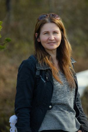 Portrait of a beautiful woman in the woods. Outdoor shot.の写真素材