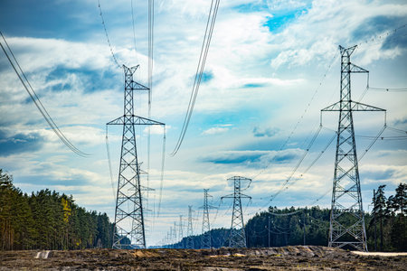 High-voltage power lines on the background of the blue skyの写真素材