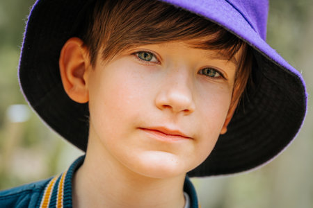 Portrait of a young boy in a hat, close-upの写真素材