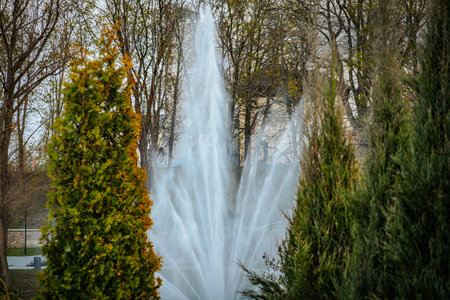 Fountain in the park in the early spring. City landscape.の写真素材