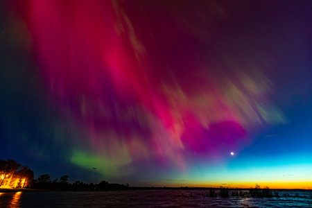 Aurora borealis, northern lights in the night sky.の写真素材