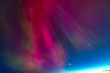 Aurora borealis in the night sky, northern lights.の写真素材