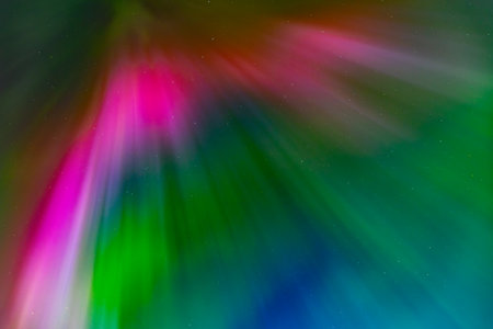 abstract colorful background with rays of light and blur bokehの写真素材